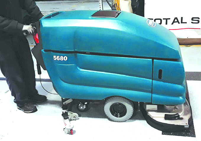 Testing refurbished commercial floor scrubber